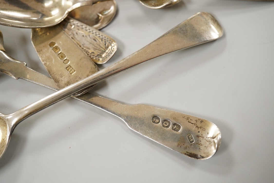 A small quantity of assorted mainly 19th century silver flatware including table spoons and teaspoons, various dates, patterns and makers, together with a silver crumb scoop(lacking handle), five 19th century Russian 94